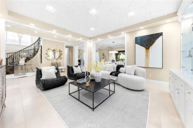 a living room with furniture fireplace and a table