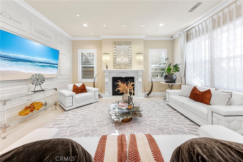 123 Calderon Irvine, CA 92618 - Photo 13 of 74 a living room with furniture fireplace and a large window