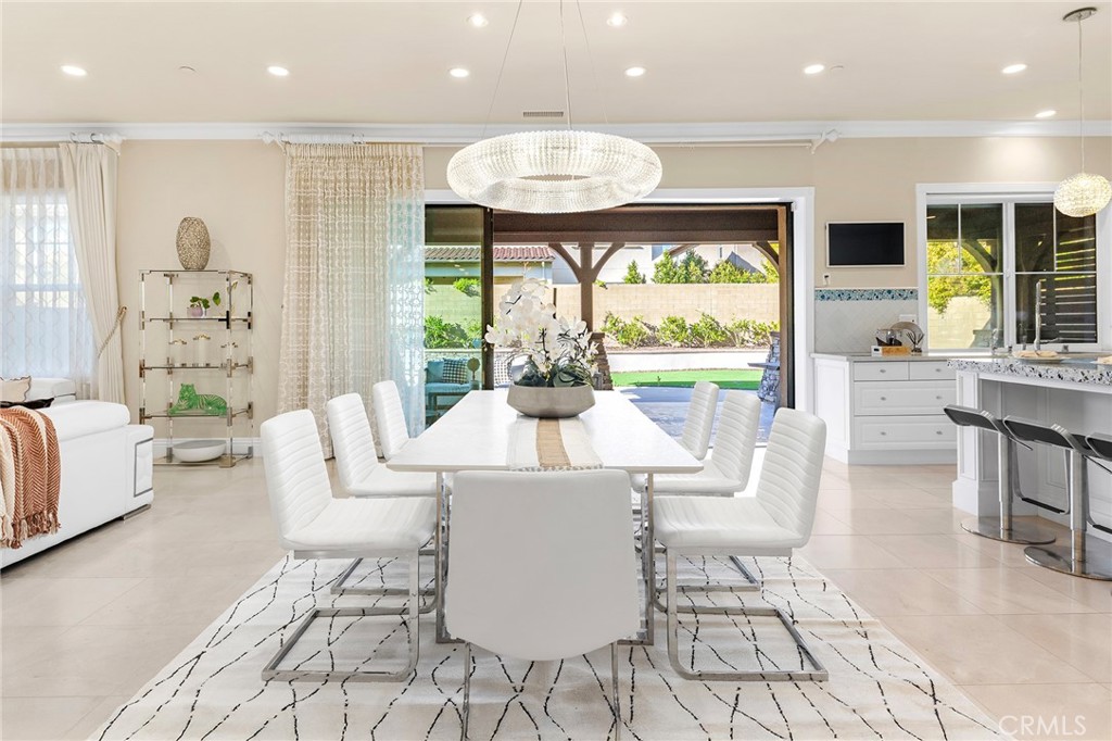 123 Calderon Irvine, CA 92618 - Photo 17 of 74 a view of a dining room with furniture wooden floor and a chandelier