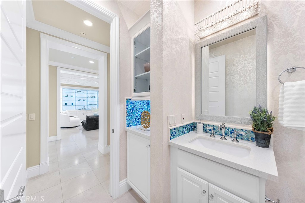 123 Calderon Irvine, CA 92618 - Photo 26 of 74 a en suite bathroom with a sink a mirror and a shower