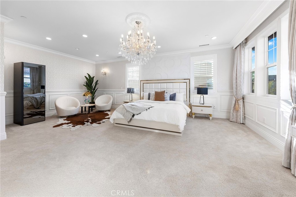 123 Calderon Irvine, CA 92618 - Photo 37 of 74 a living room with furniture and a chandelier