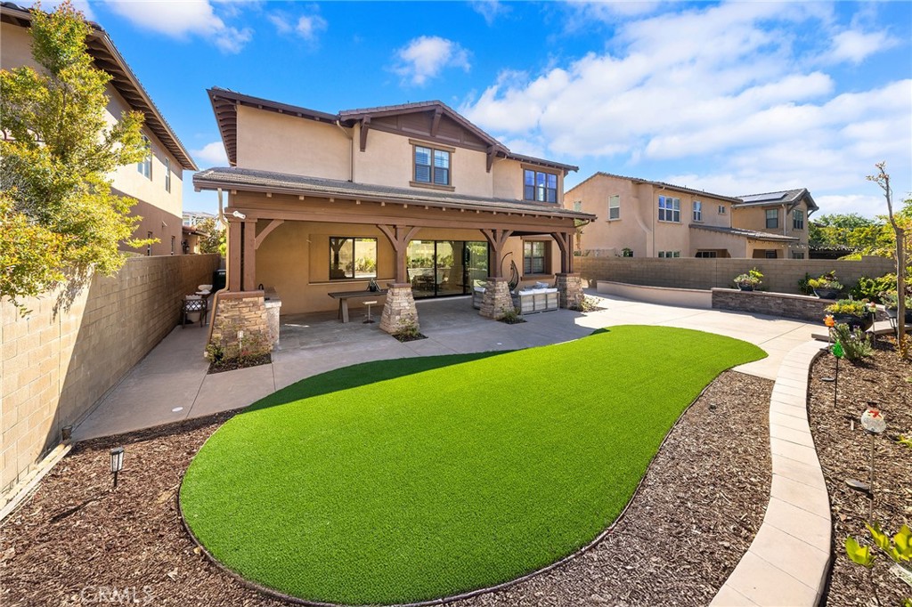 123 Calderon Irvine, CA 92618 - Photo 56 of 74 a view of a house with a backyard porch and sitting area