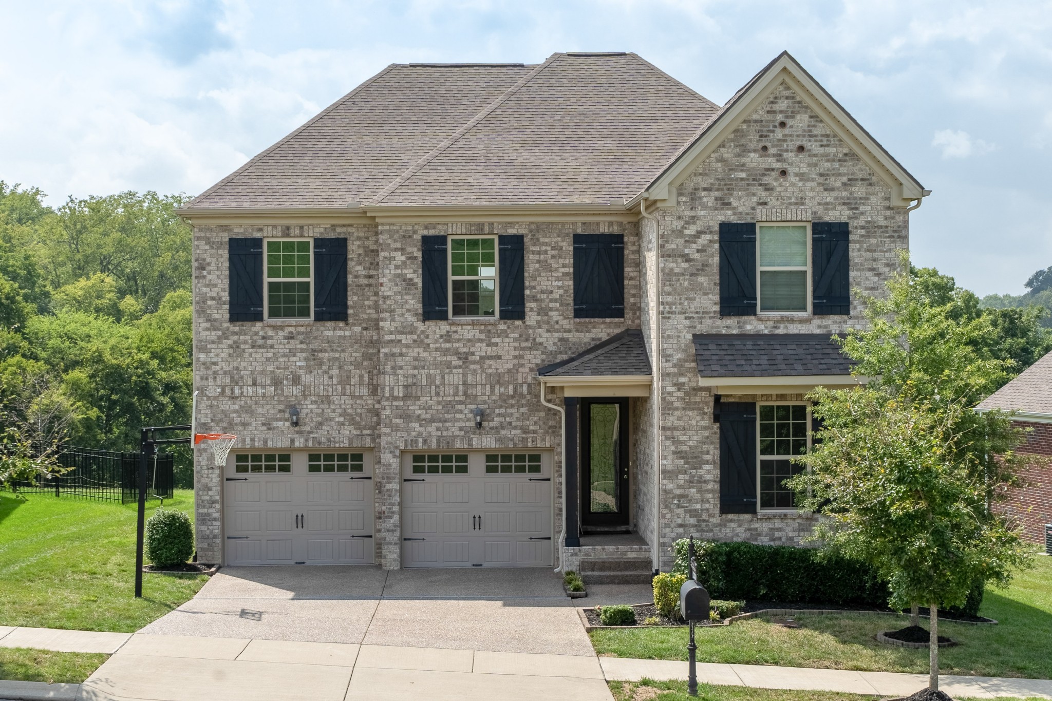 238 Fowler Circle Franklin, TN 37064 - Photo 1 of 45 a front view of a house with a garden