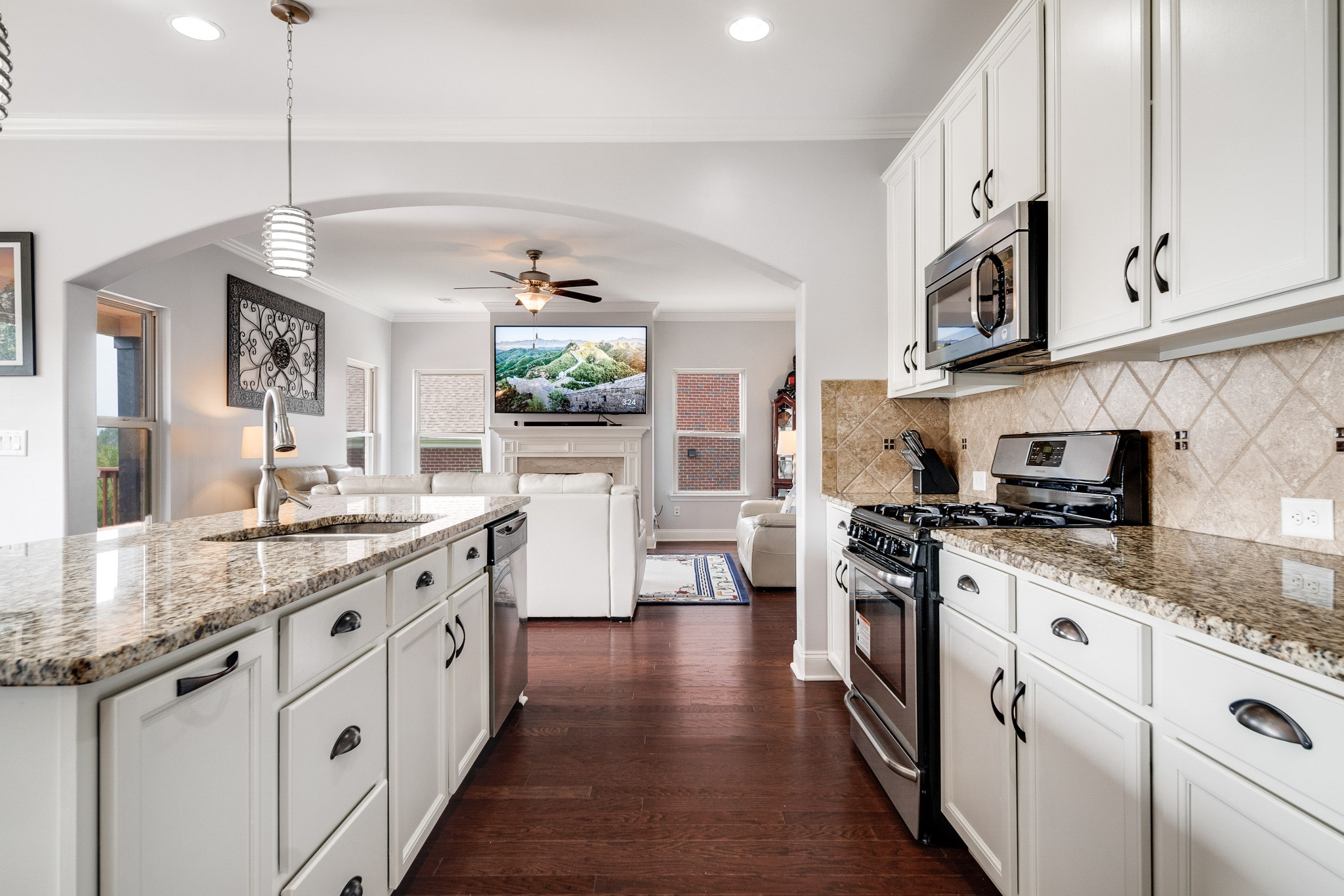 238 Fowler Circle Franklin, TN 37064 - Photo 13 of 45 a kitchen with stainless steel appliances granite countertop a stove and cabinets