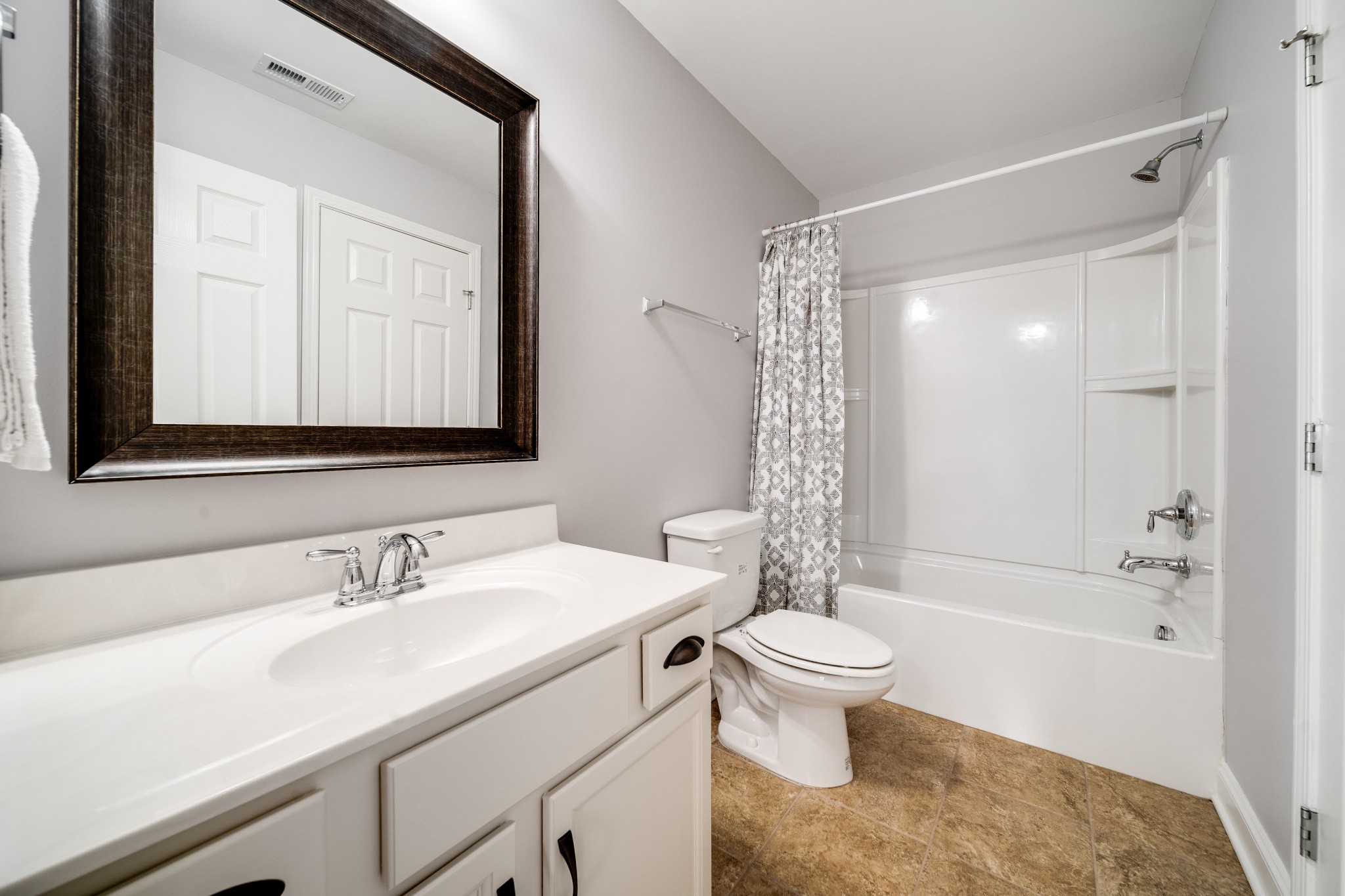 238 Fowler Circle Franklin, TN 37064 - Photo 24 of 45 a bathroom with a sink a toilet and a large mirror