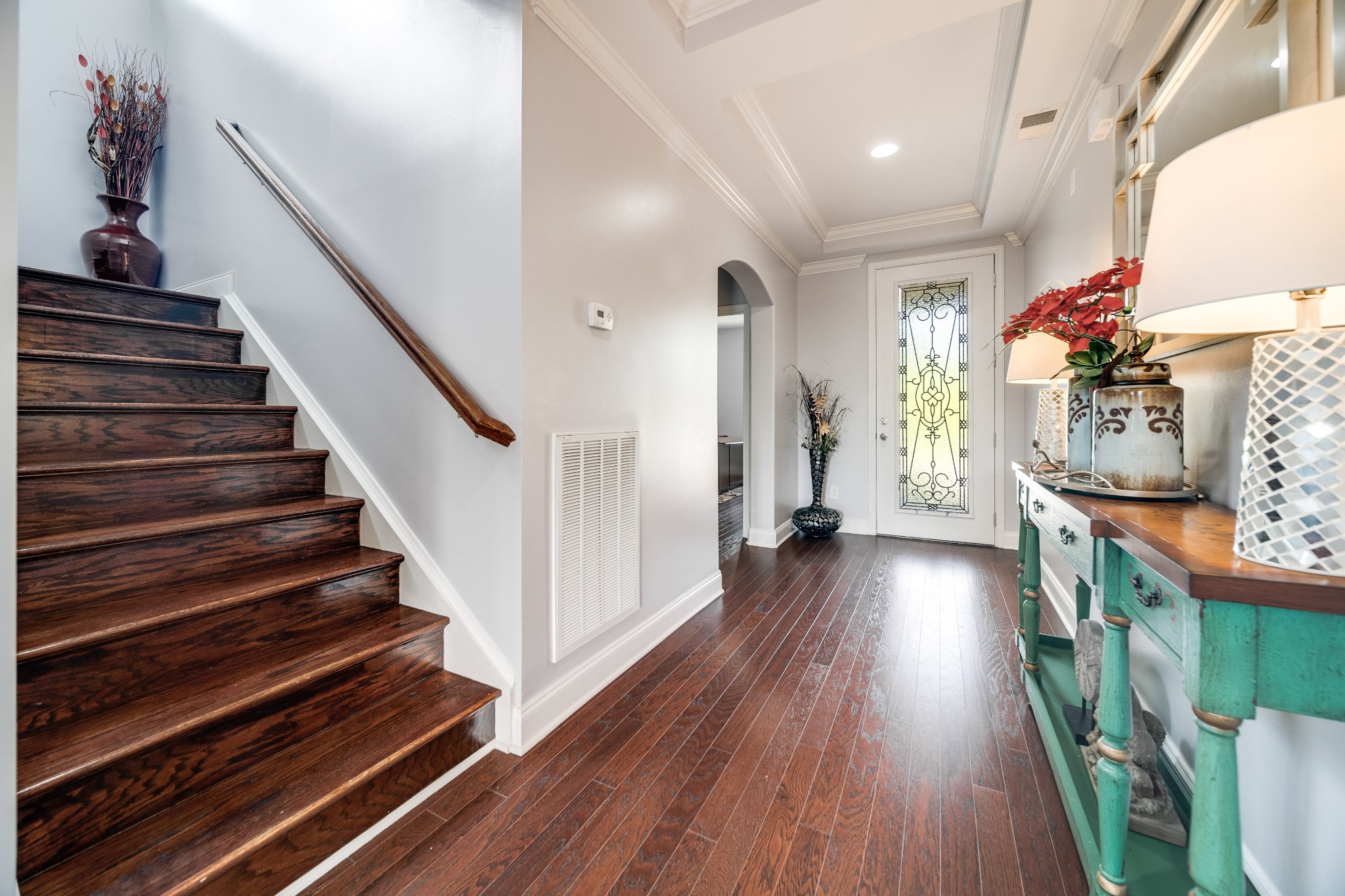 238 Fowler Circle Franklin, TN 37064 - Photo 7 of 45 a view of a hallway with wooden floor and stairs