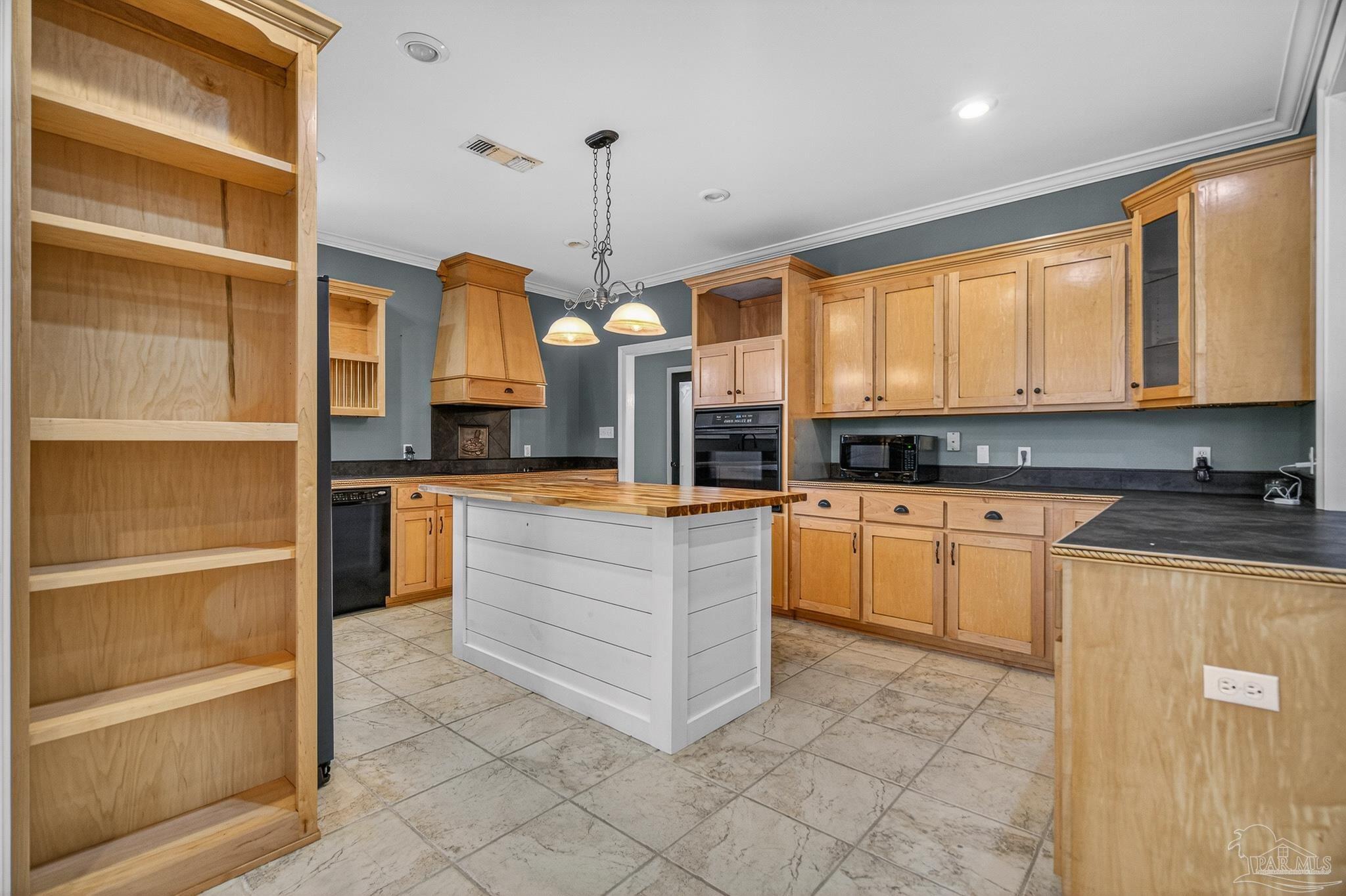 78 Hummingbird Lane Atmore, AL 36502 - Photo 11 of 55 a kitchen with stainless steel appliances kitchen island granite countertop a stove a sink and a microwave