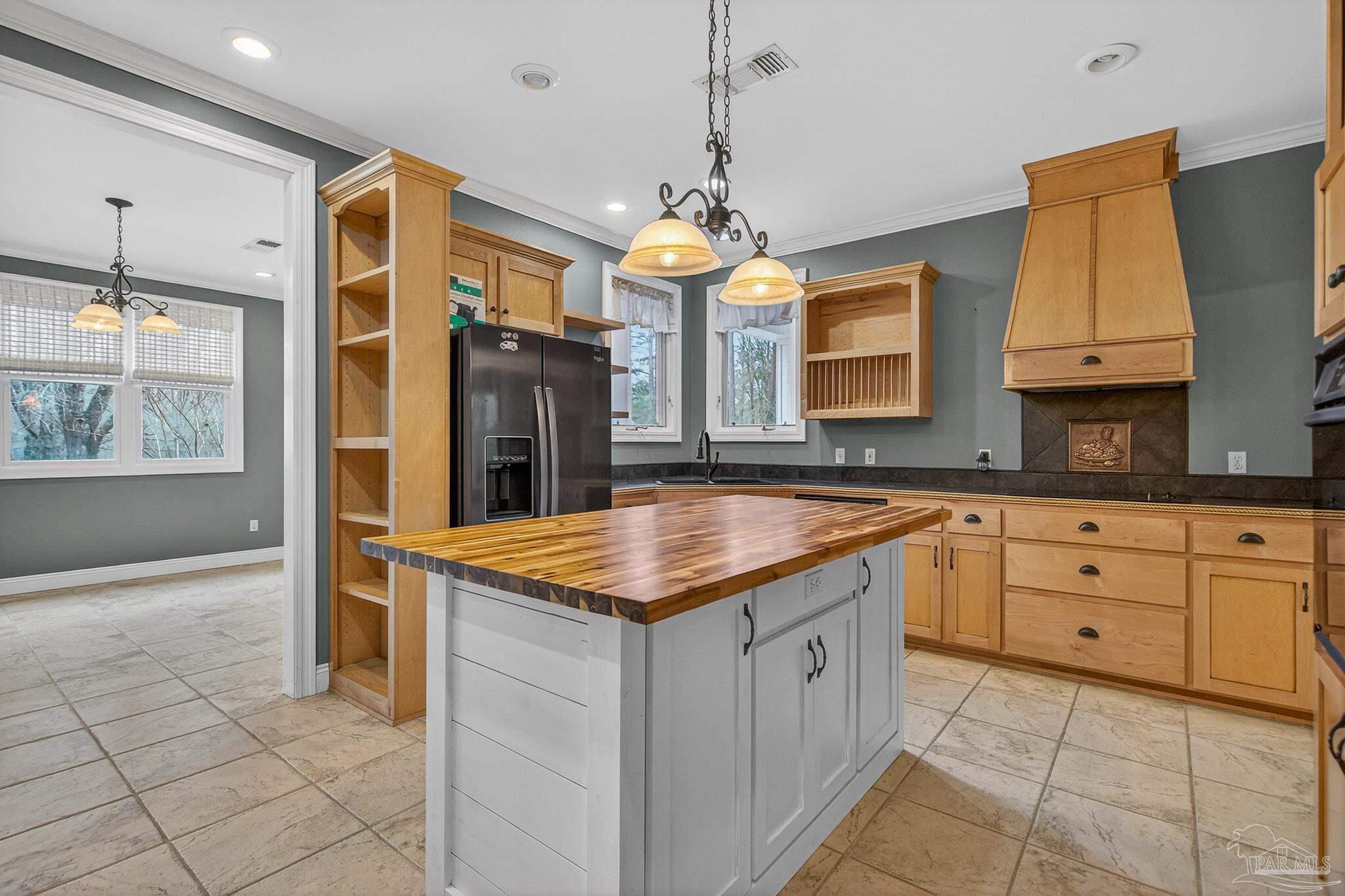 78 Hummingbird Lane Atmore, AL 36502 - Photo 12 of 55 a kitchen with granite countertop a sink and a stove