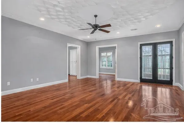 a view of an empty room with a large window