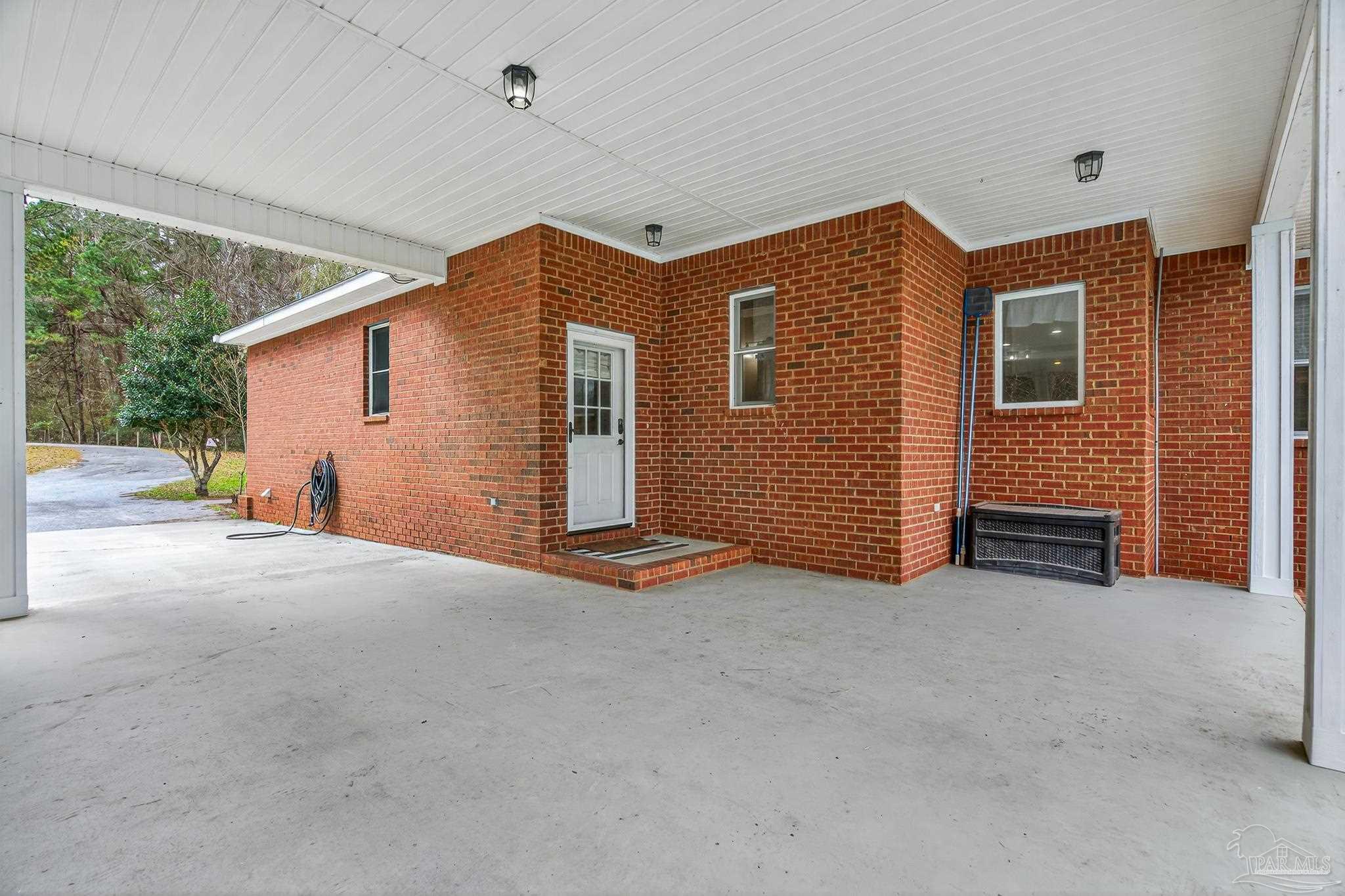 78 Hummingbird Lane Atmore, AL 36502 - Photo 45 of 55 a view of a house with porch and garage