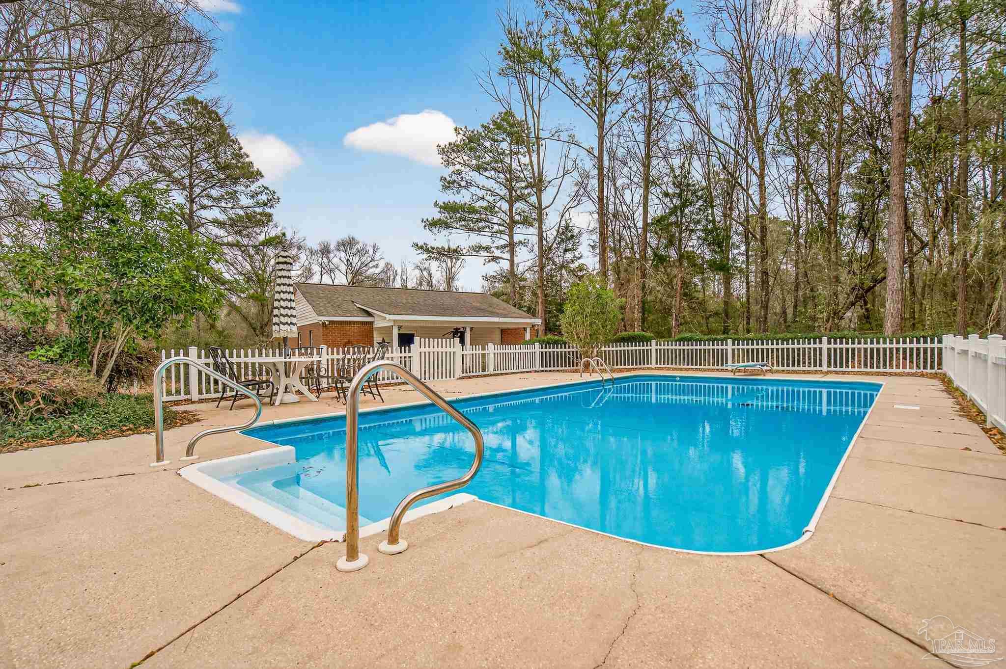 78 Hummingbird Lane Atmore, AL 36502 - Photo 47 of 55 a view of a swimming pool with a patio