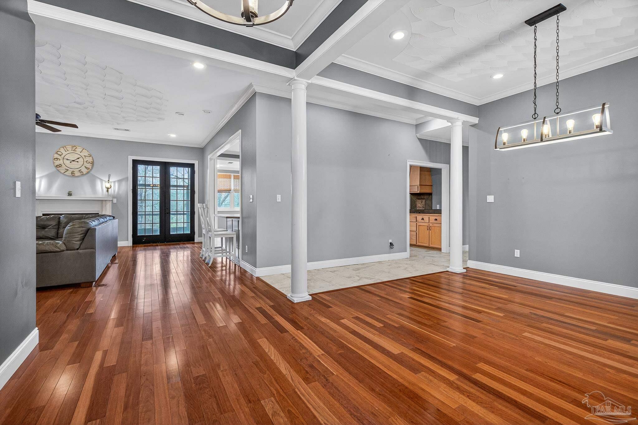 78 Hummingbird Lane Atmore, AL 36502 - Photo 6 of 55 a view of an empty room with wooden floor and a window