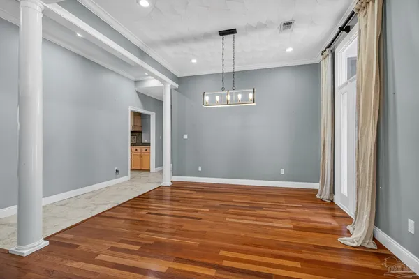 a kitchen with stainless steel appliances kitchen island granite countertop a stove a sink and a microwave