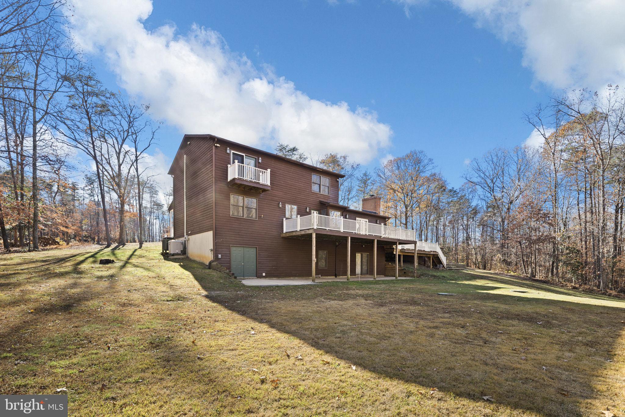 4075 Red Gate Lane King George, VA 22485 - Photo 11 of 69 a front view of a house with a yard