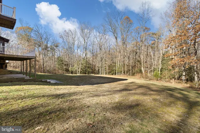 a kitchen with stainless steel appliances a stove sink and cabinets