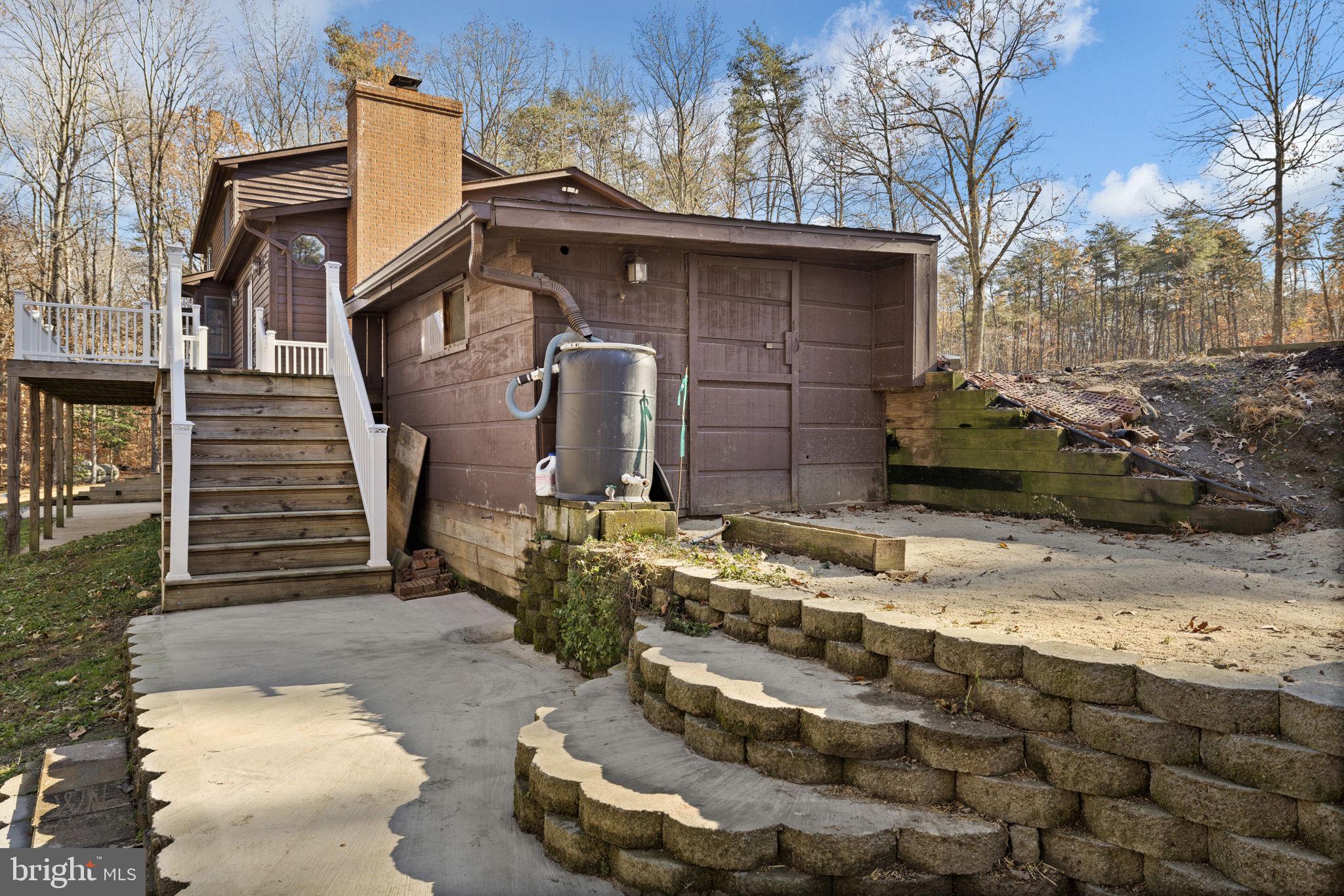 4075 Red Gate Lane King George, VA 22485 - Photo 22 of 69 a front view of a house with a garden