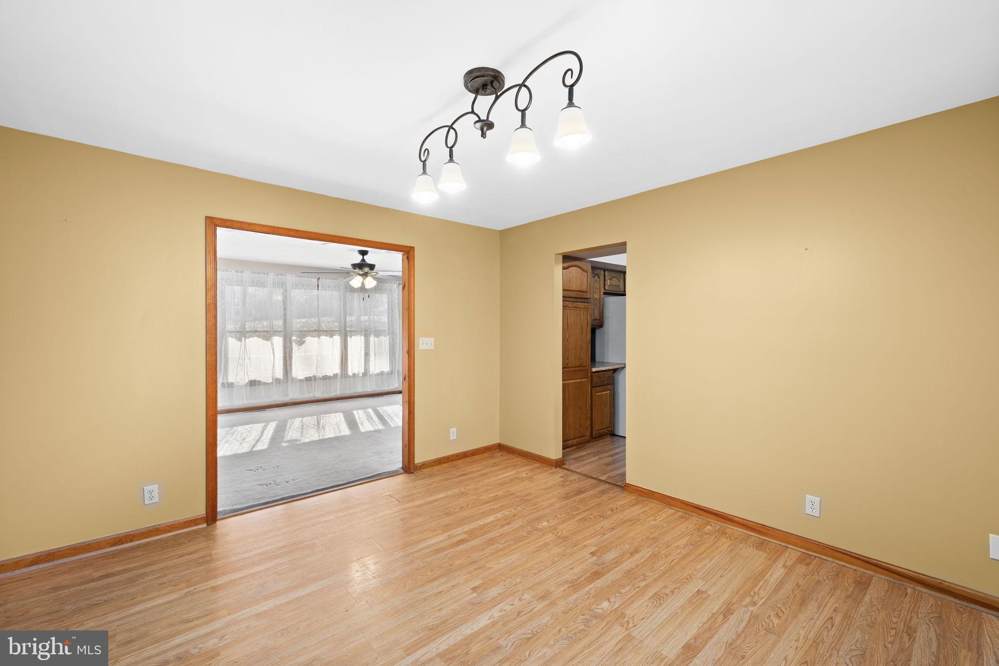 4075 Red Gate Lane King George, VA 22485 - Photo 34 of 69 a view of an empty room with wooden floor and a window