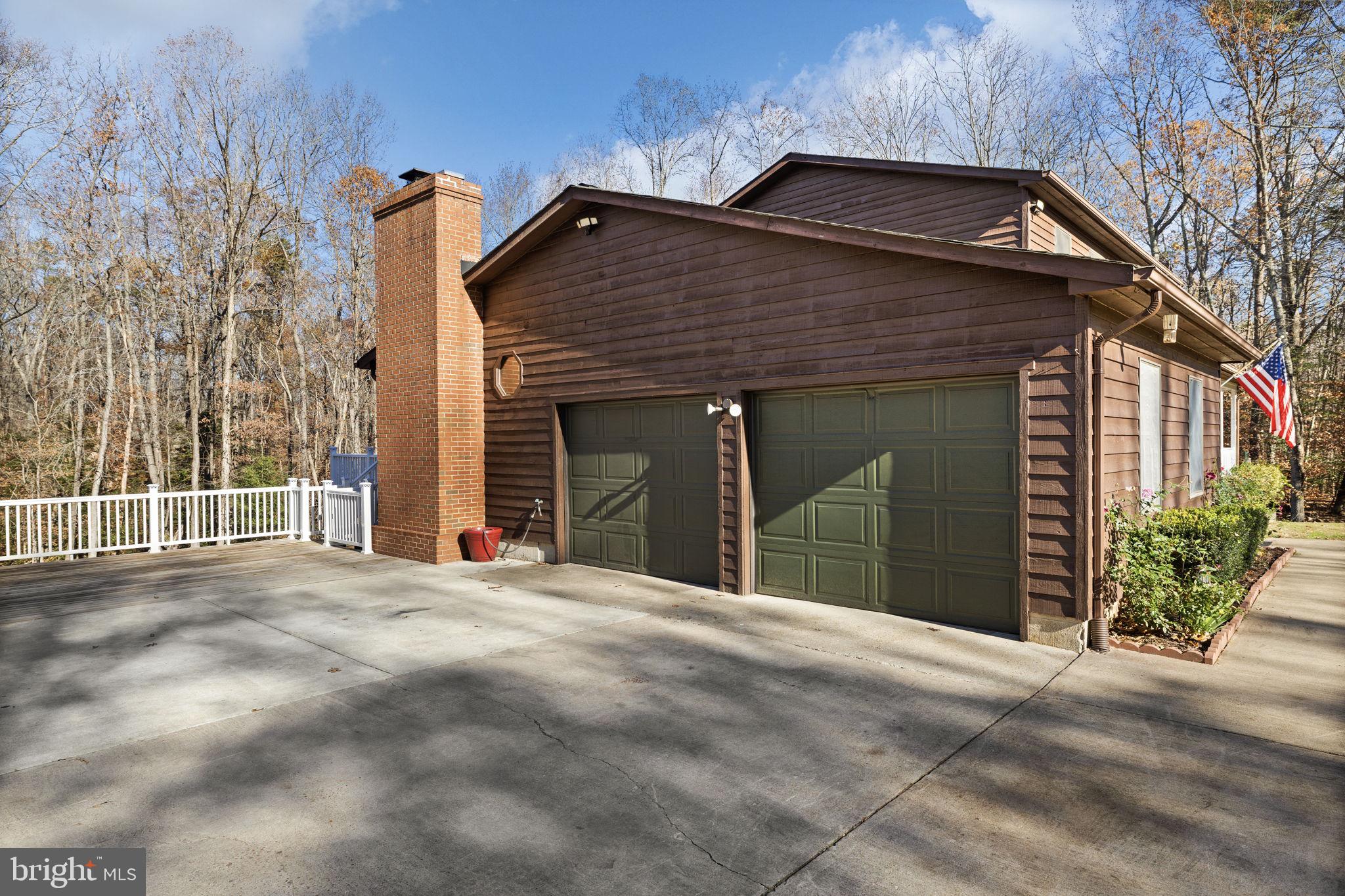 4075 Red Gate Lane King George, VA 22485 - Photo 4 of 69 a front view of a house with a garden