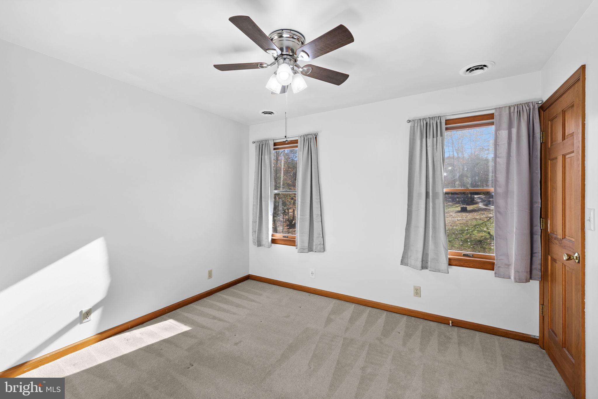 4075 Red Gate Lane King George, VA 22485 - Photo 48 of 69 an empty room with windows and fan