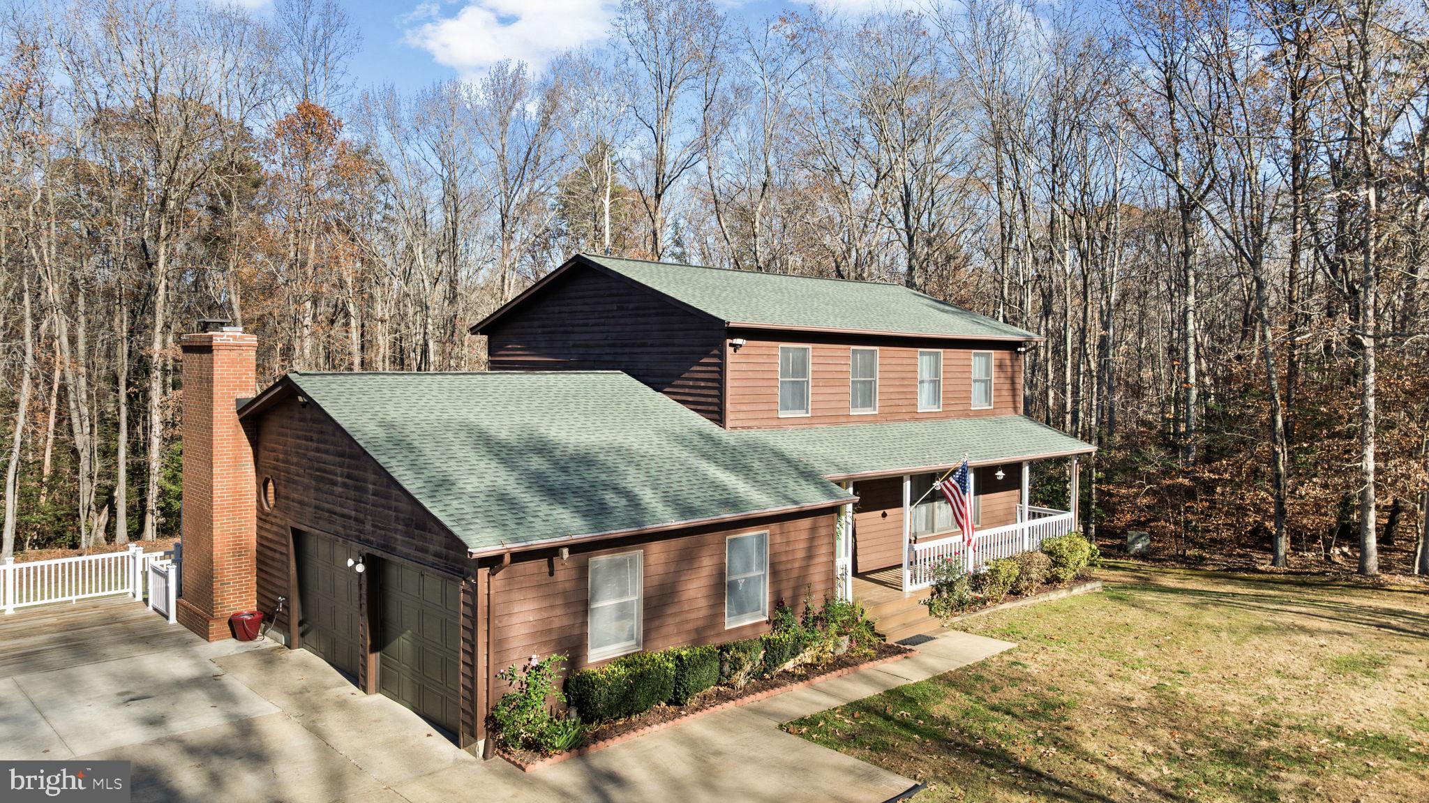 4075 Red Gate Lane King George, VA 22485 - Photo 5 of 69 front view of house with a yard and large trees