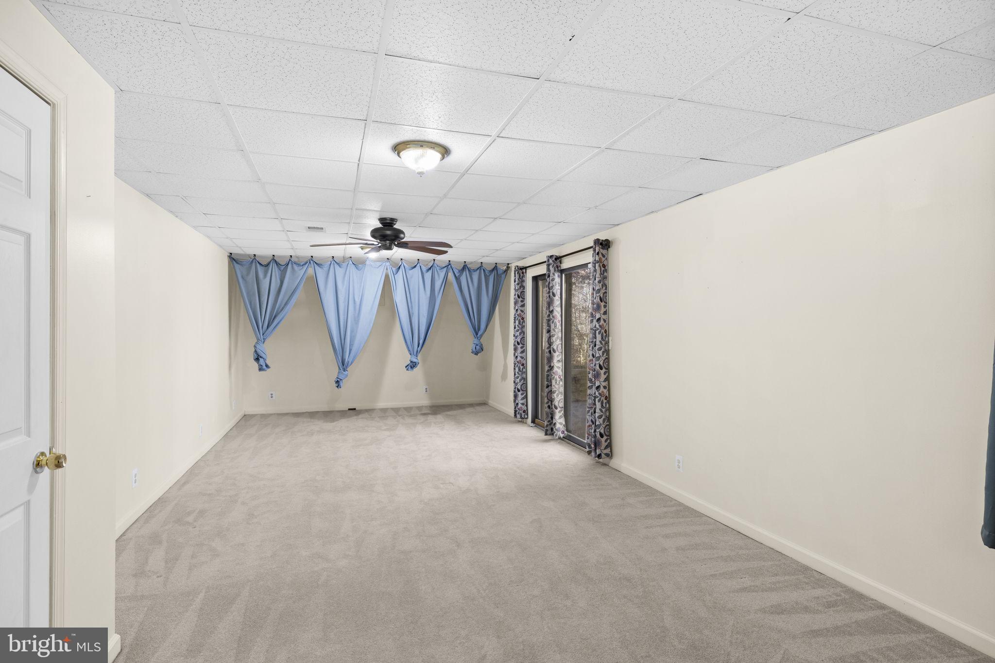 4075 Red Gate Lane King George, VA 22485 - Photo 57 of 69 an empty room with a ceiling fan and window
