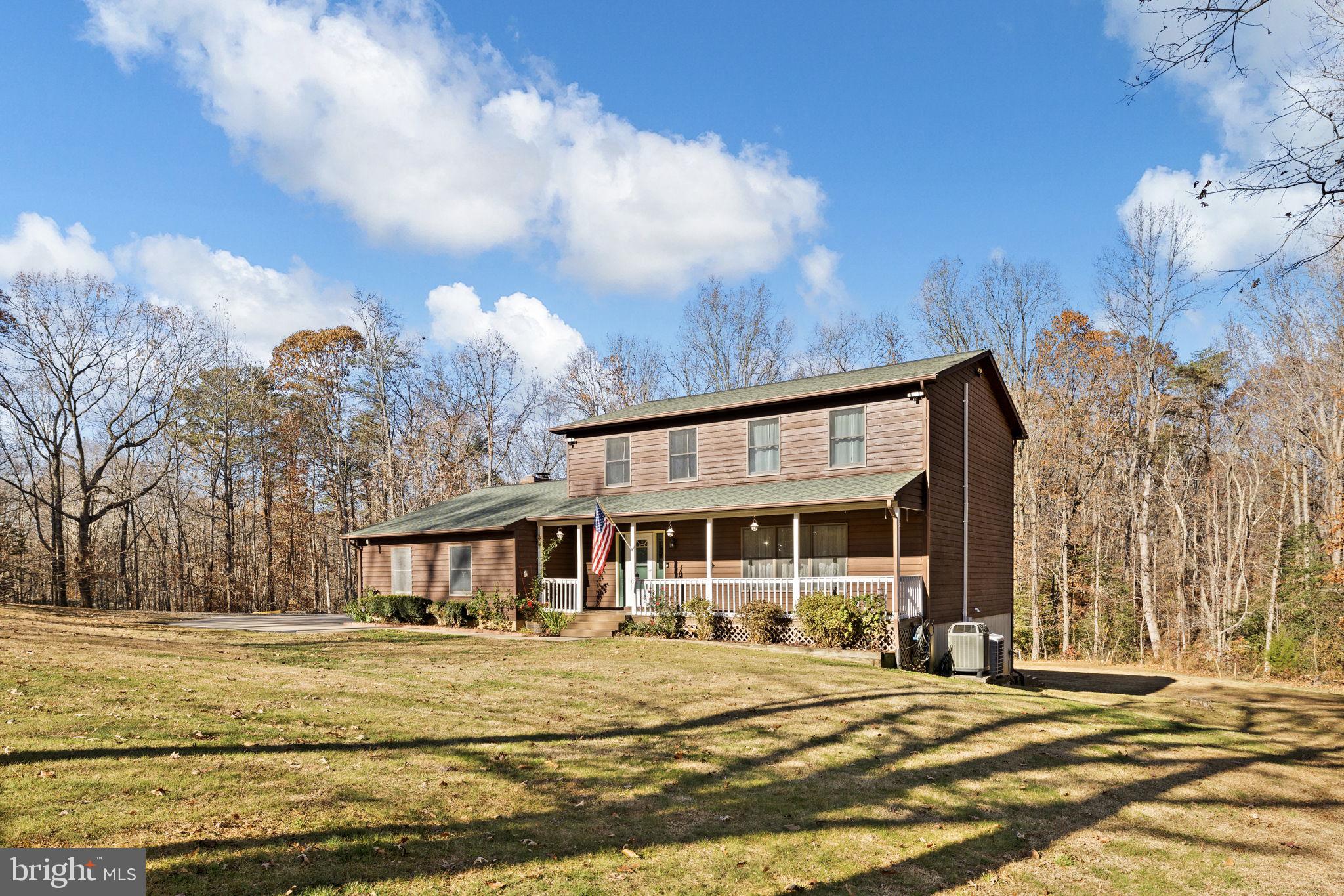 4075 Red Gate Lane King George, VA 22485 - Photo 10 of 69 a front view of a house with garden