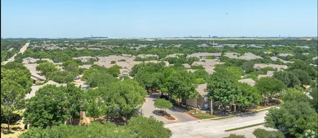 an aerial view of a city with lots of residential buildings