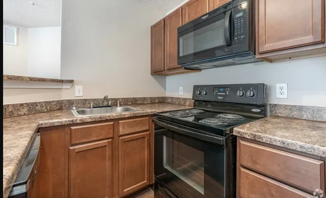 a kitchen with a stove and a microwave
