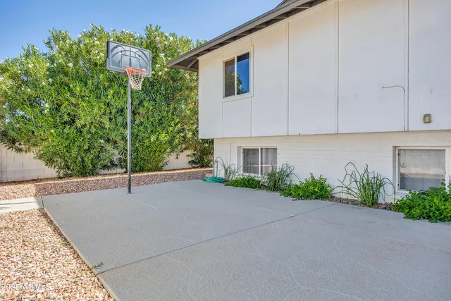 a bed room with a bed and a chandelier