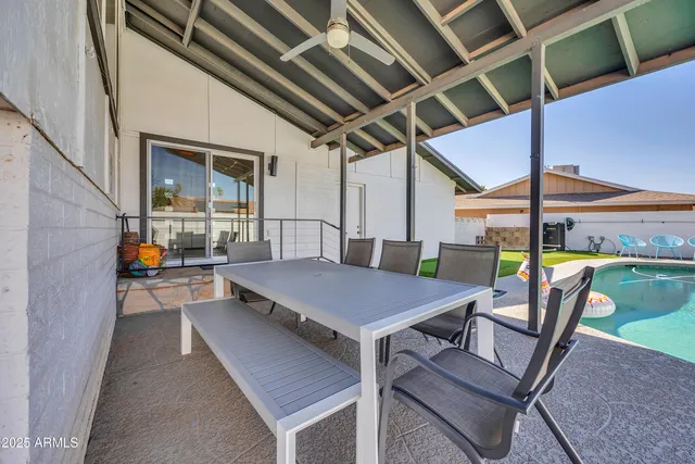 a bedroom with bed and a window