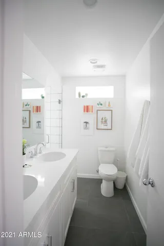 a bathroom with a sink a mirror and a shower