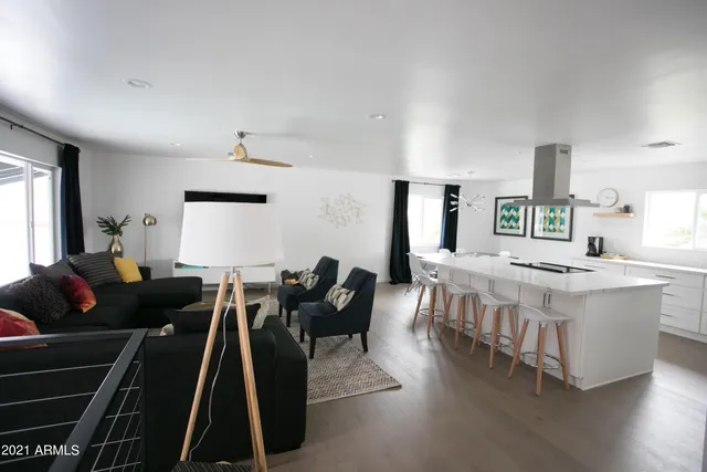 a house view with swimming pool and sitting space