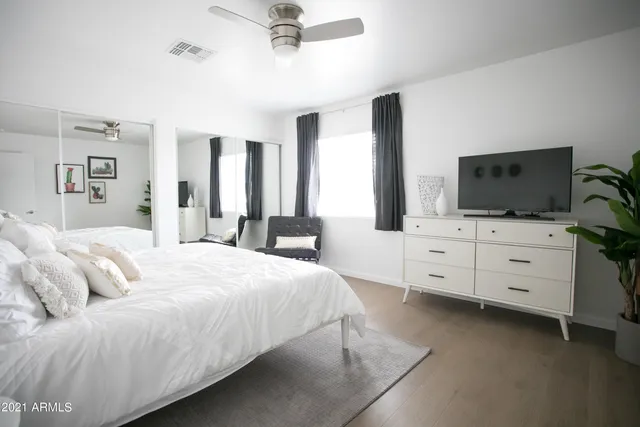 a kitchen with stainless steel appliances kitchen island granite countertop a sink and a refrigerator