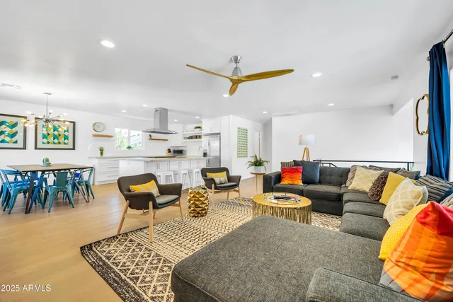 a kitchen with stainless steel appliances a sink a stove and a refrigerator