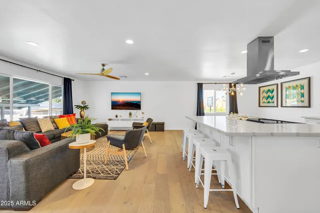 a kitchen with a sink a stove top oven and cabinets