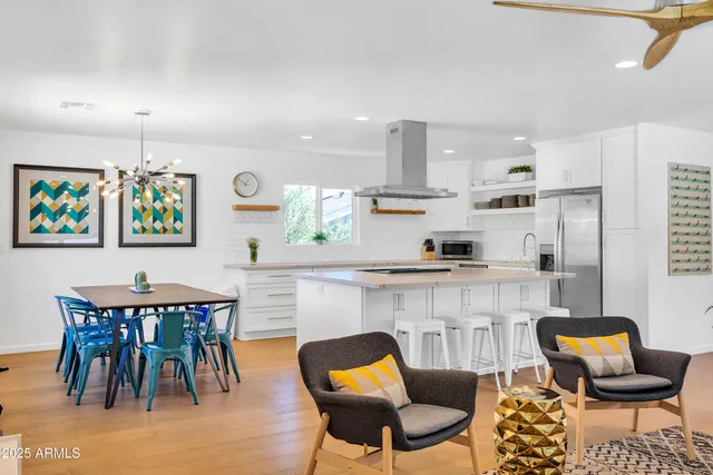 a living room with furniture a flat screen tv and rug floor
