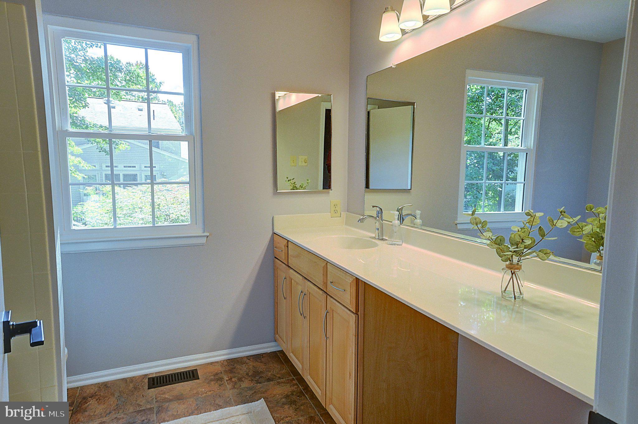 10971 Hickory Ridge Road Columbia, MD 21044 - Photo 19 of 31 Hall Bath With Tile Floors And Extended Vanity