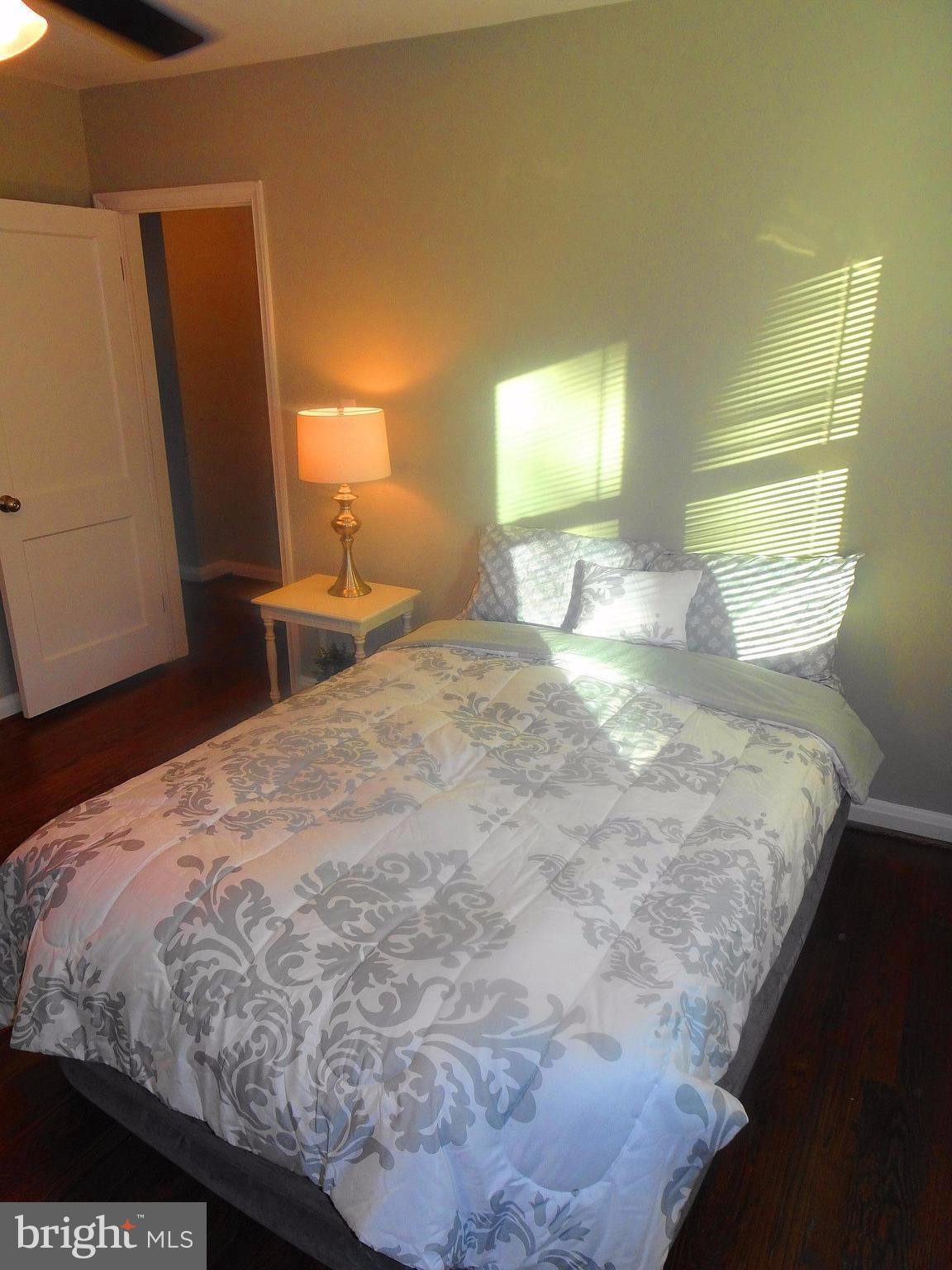1406 Meridene Drive Baltimore, MD 21239 - Photo 13 of 30 a bedroom with a bed and a window