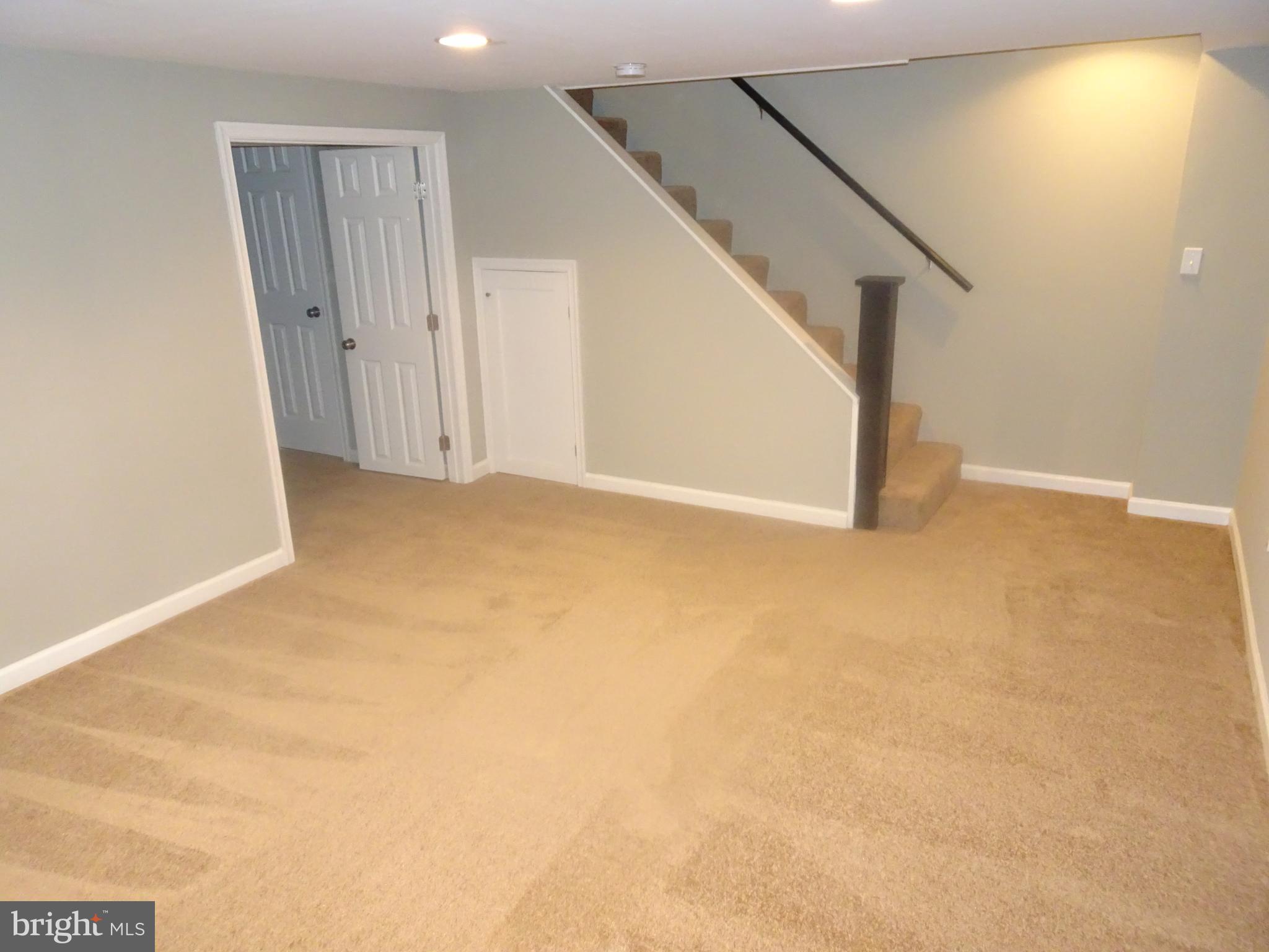 1406 Meridene Drive Baltimore, MD 21239 - Photo 20 of 30 a view of an empty room with stairs