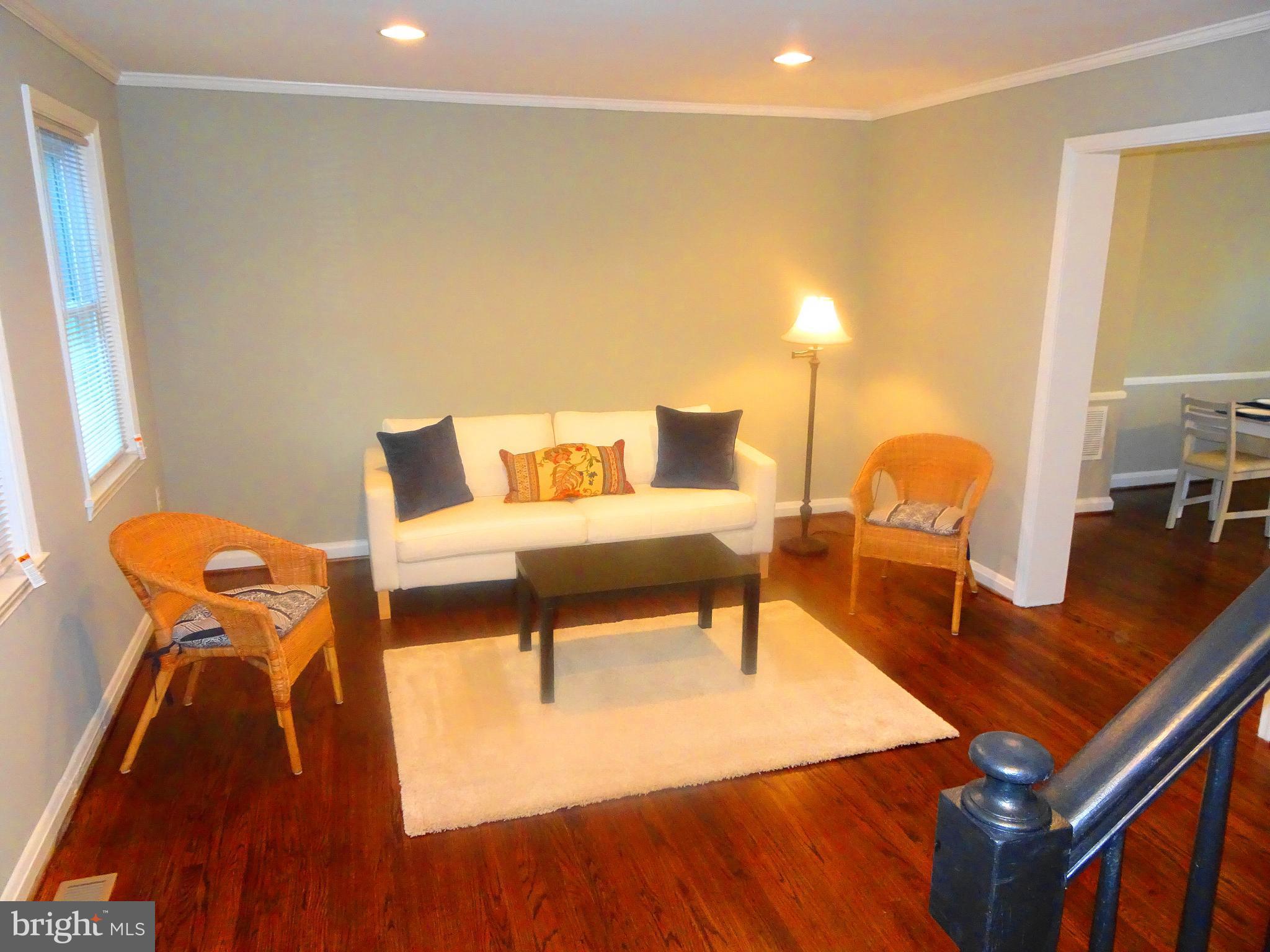 1406 Meridene Drive Baltimore, MD 21239 - Photo 7 of 30 a living room with furniture and a table