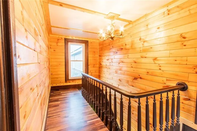 a view of a porch with wooden floor and stairs