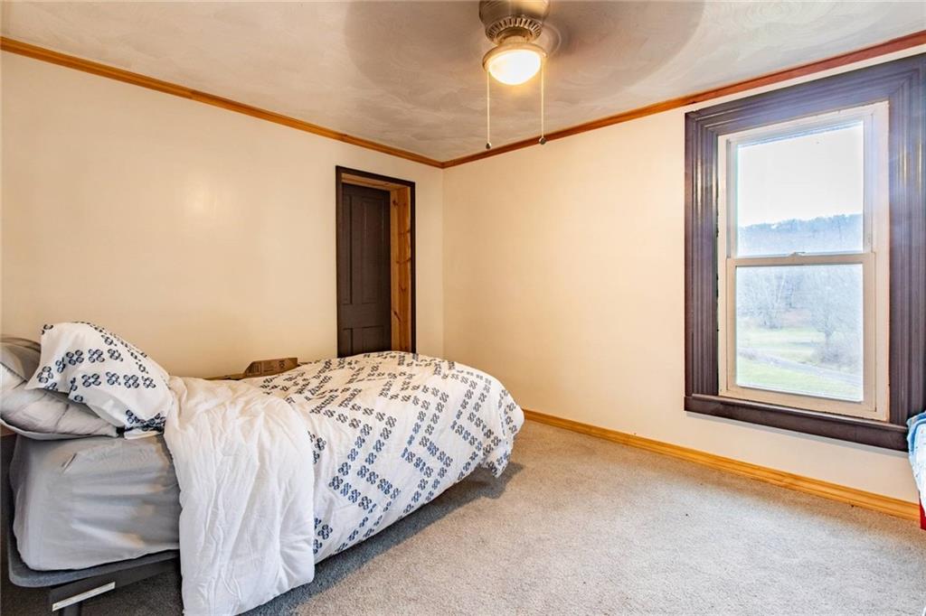 437 Petrolia Road Chicora, PA 16025 - Photo 15 of 29 a bedroom with a bed and a window