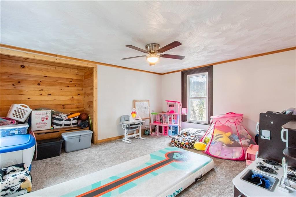 437 Petrolia Road Chicora, PA 16025 - Photo 16 of 29 a living room with furniture and a window