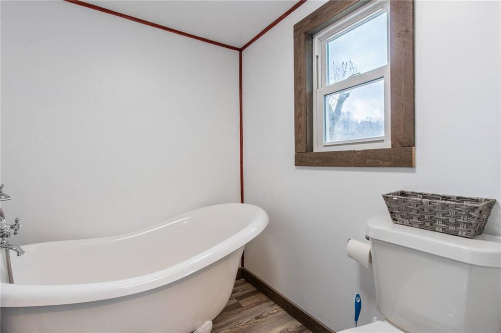 437 Petrolia Road Chicora, PA 16025 - Photo 21 of 29 a white bath tub sitting next to a white sink and vanity
