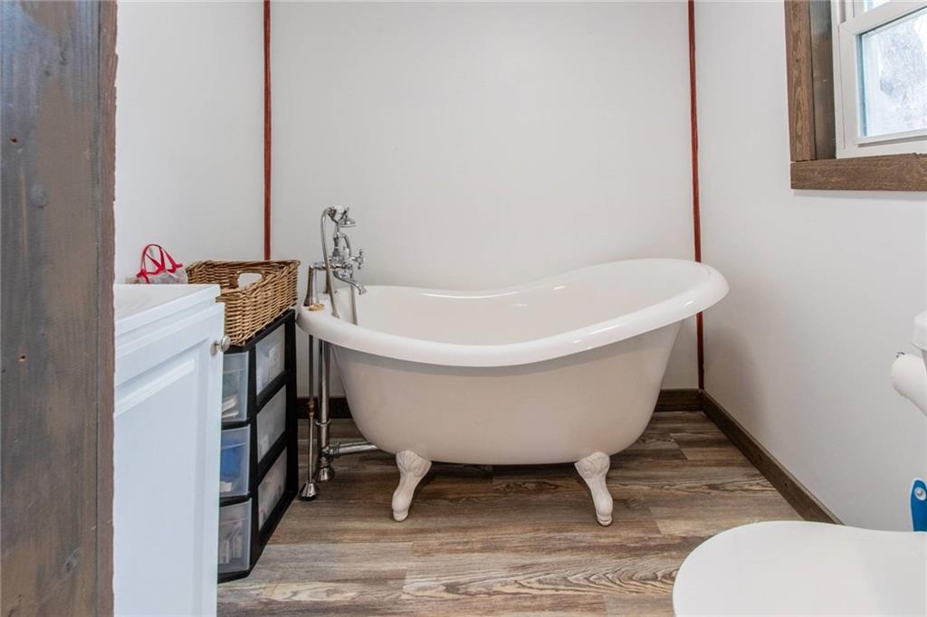 437 Petrolia Road Chicora, PA 16025 - Photo 22 of 29 a white bath tub sitting in a bathroom