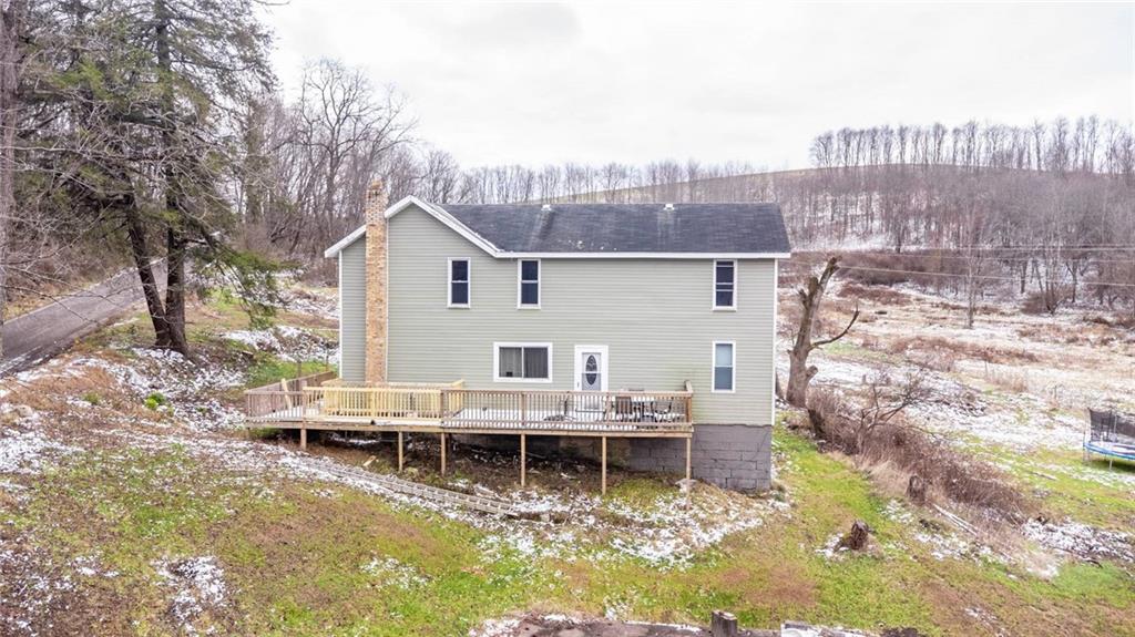 437 Petrolia Road Chicora, PA 16025 - Photo 24 of 29 a view of a lake with a house