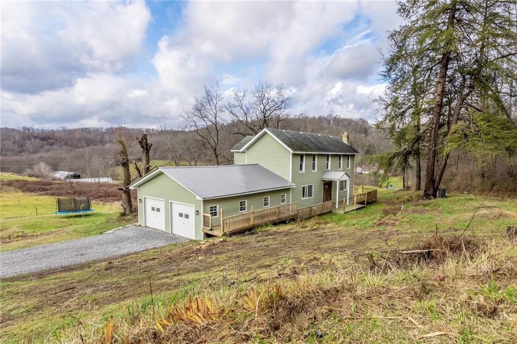 437 Petrolia Road Chicora, PA 16025 - Photo 26 of 29 a view of a house with a big yard and large tree