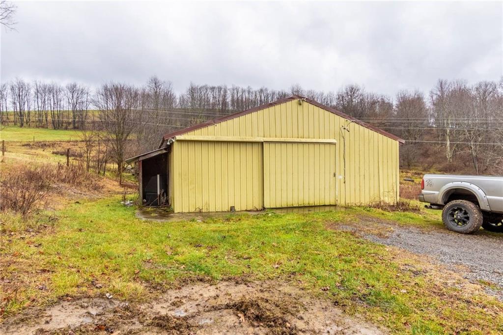 437 Petrolia Road Chicora, PA 16025 - Photo 27 of 29 a view of a house with a garden and chair