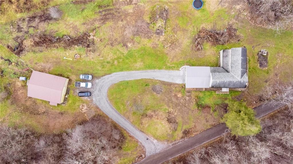 437 Petrolia Road Chicora, PA 16025 - Photo 3 of 29 view of a wooden house with a yard and large trees