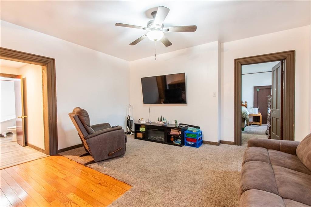 437 Petrolia Road Chicora, PA 16025 - Photo 8 of 29 a living room with furniture and a flat screen tv